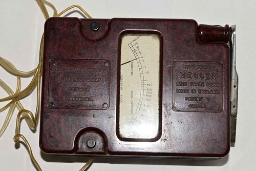 Vintage red bakelite megger - red,